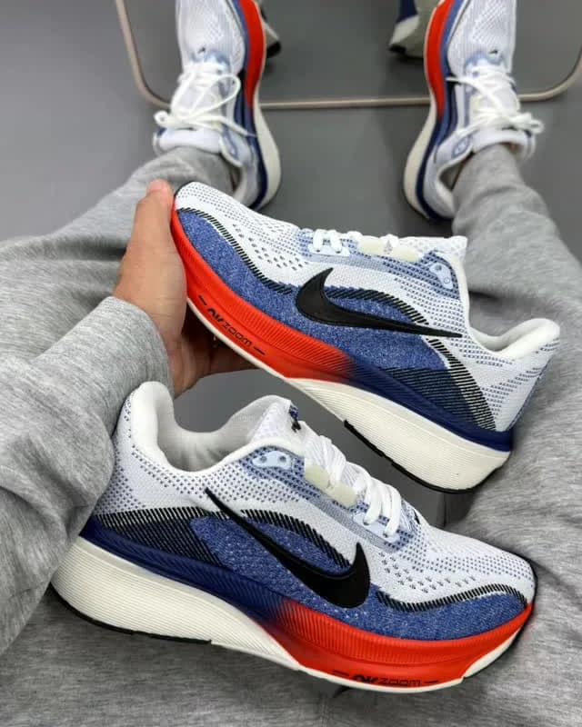 Nike Vaporfly azul e laranja